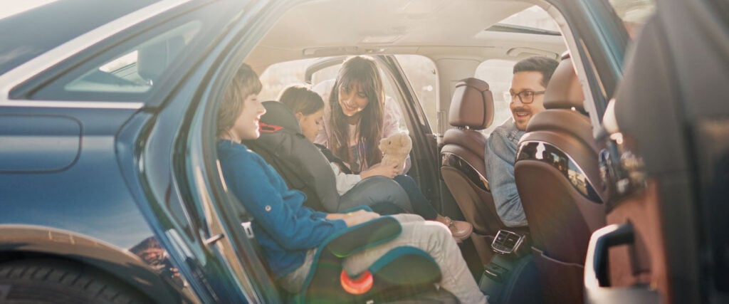 family getting in their car